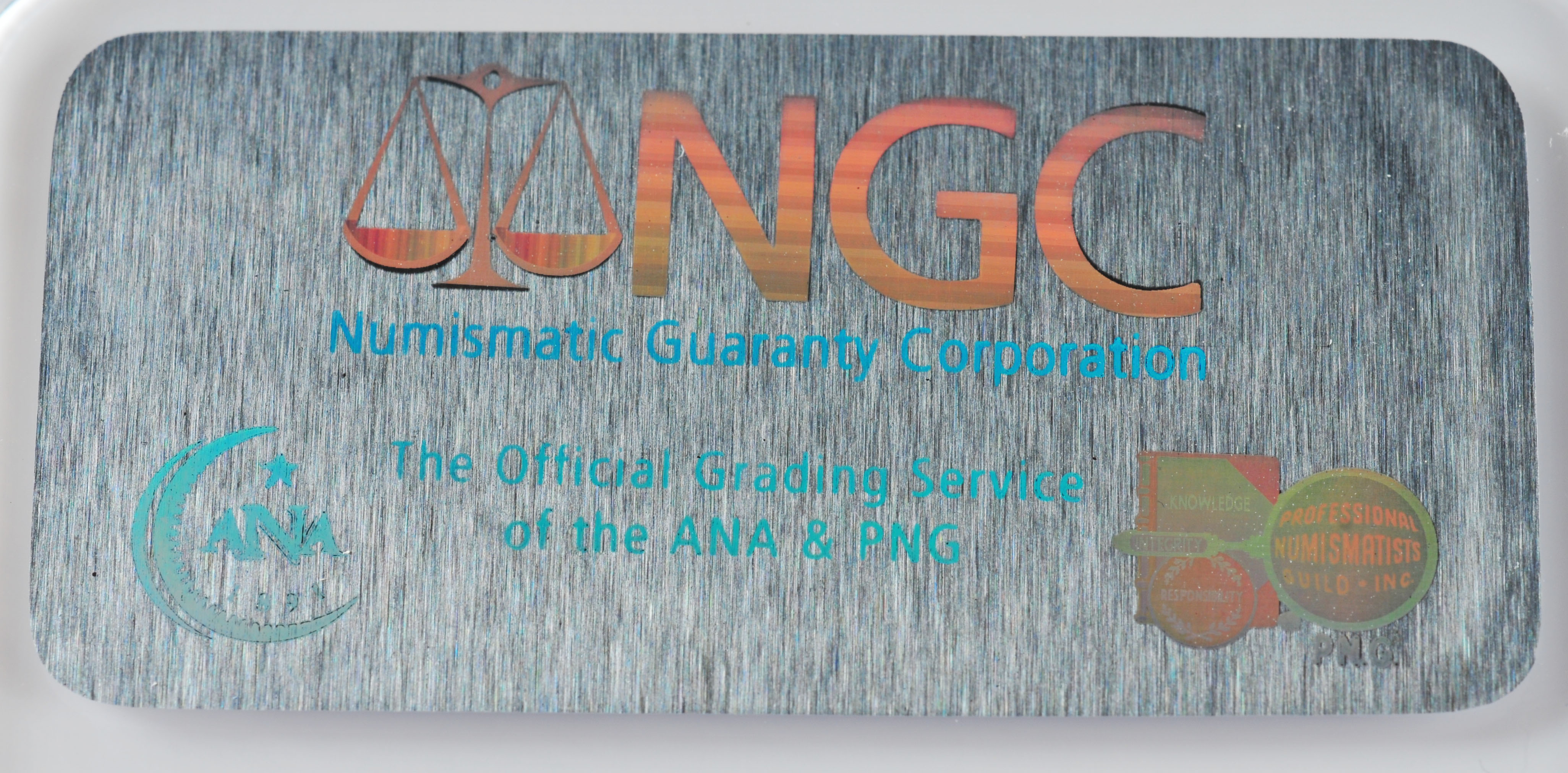 Encapsulated Brilliant uncirculated First Day of Issue (by NGC) 2007 P George Washington Golden one dollar coin