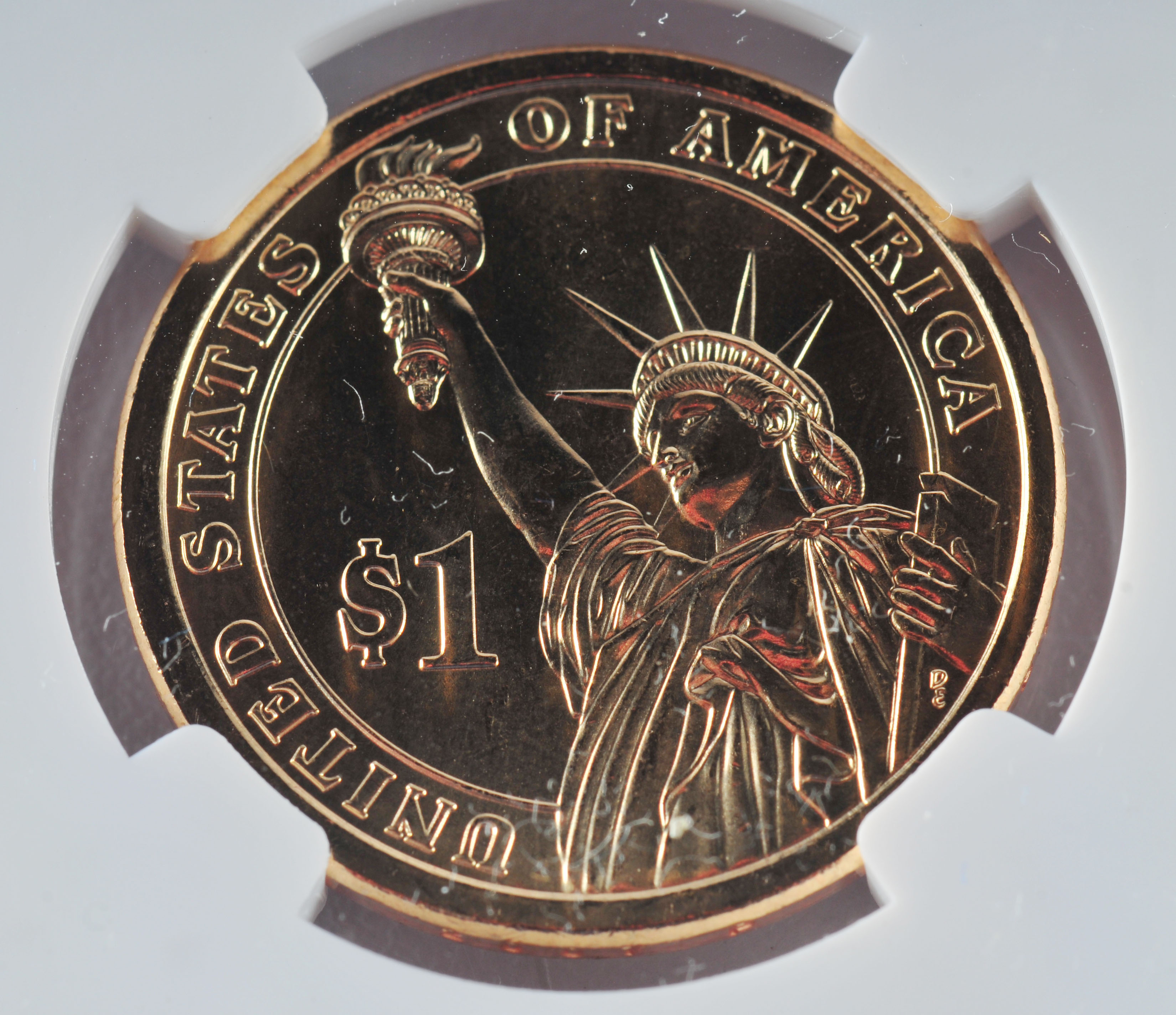 Encapsulated Brilliant uncirculated First Day of Issue (by NGC) 2007 P John Adams Golden one dollar coin