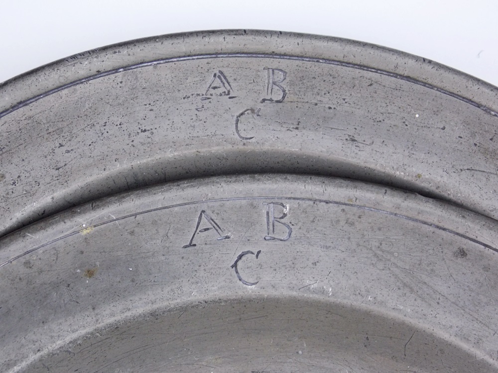 Pair of antique pewter children's plates