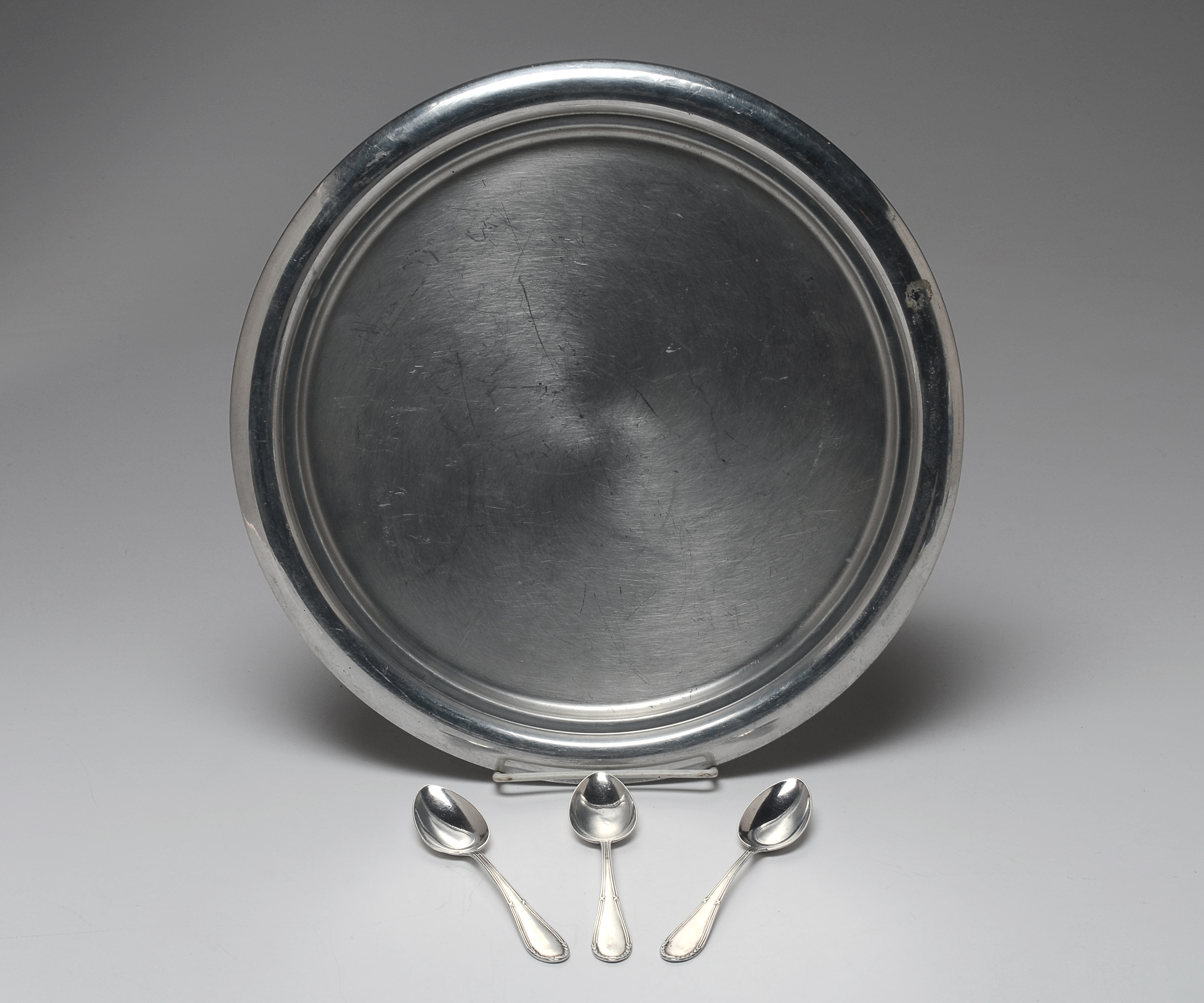 Three Early Twentieth Century Silver Plated Teaspoons and an aluminum Kromex serving plate.