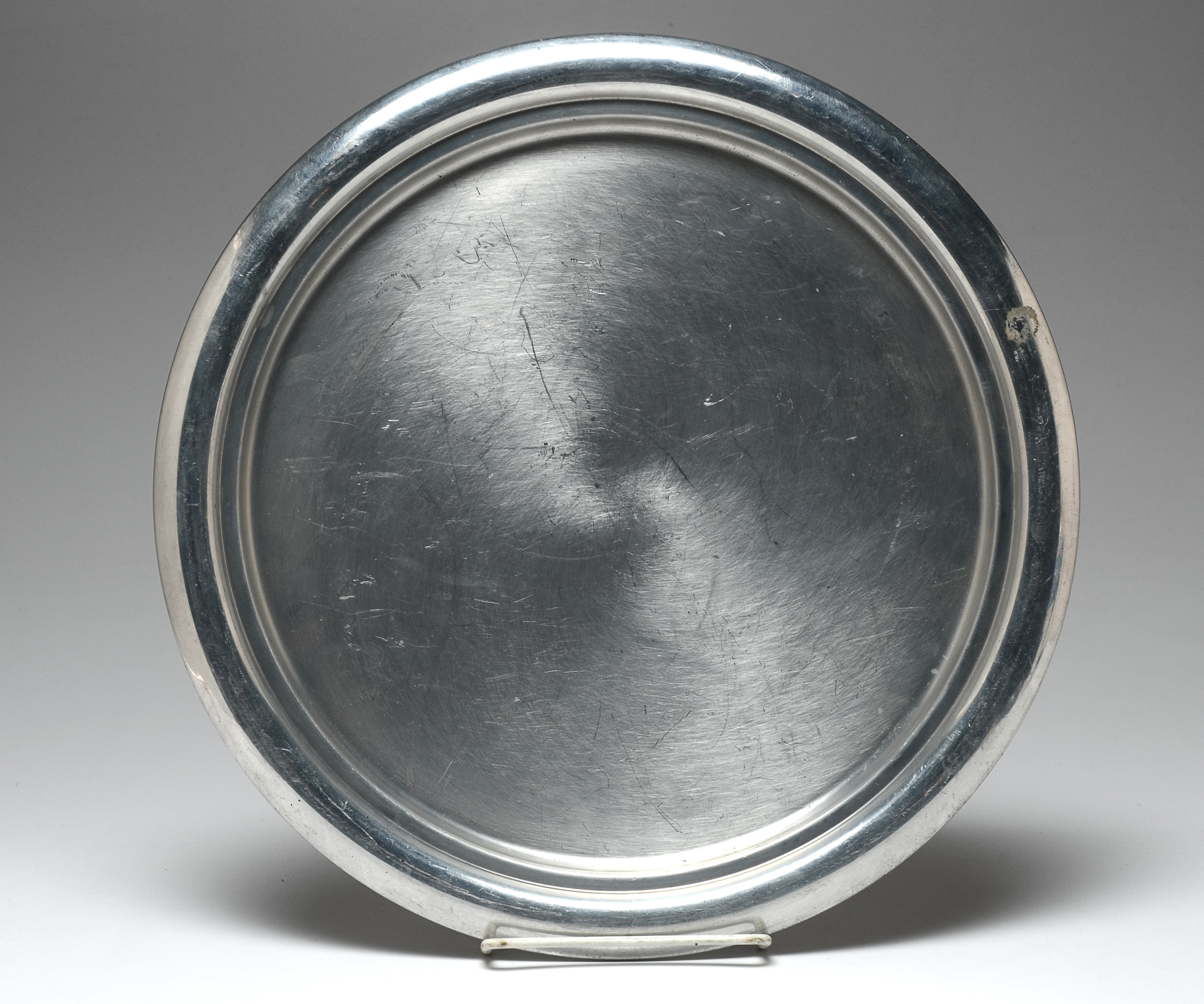 Three Early Twentieth Century Silver Plated Teaspoons and an aluminum Kromex serving plate.