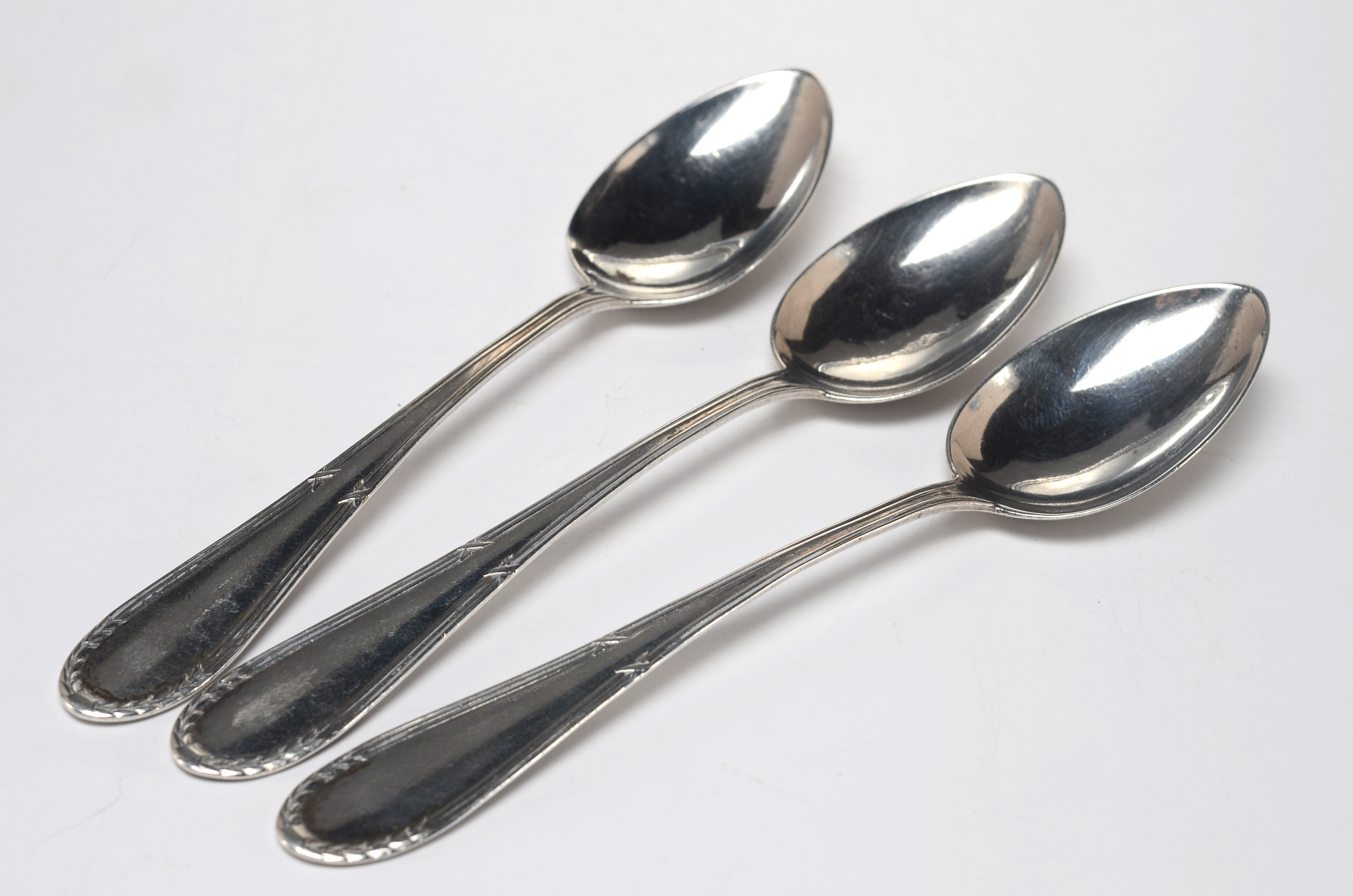 Three Early Twentieth Century Silver Plated Teaspoons and an aluminum Kromex serving plate.