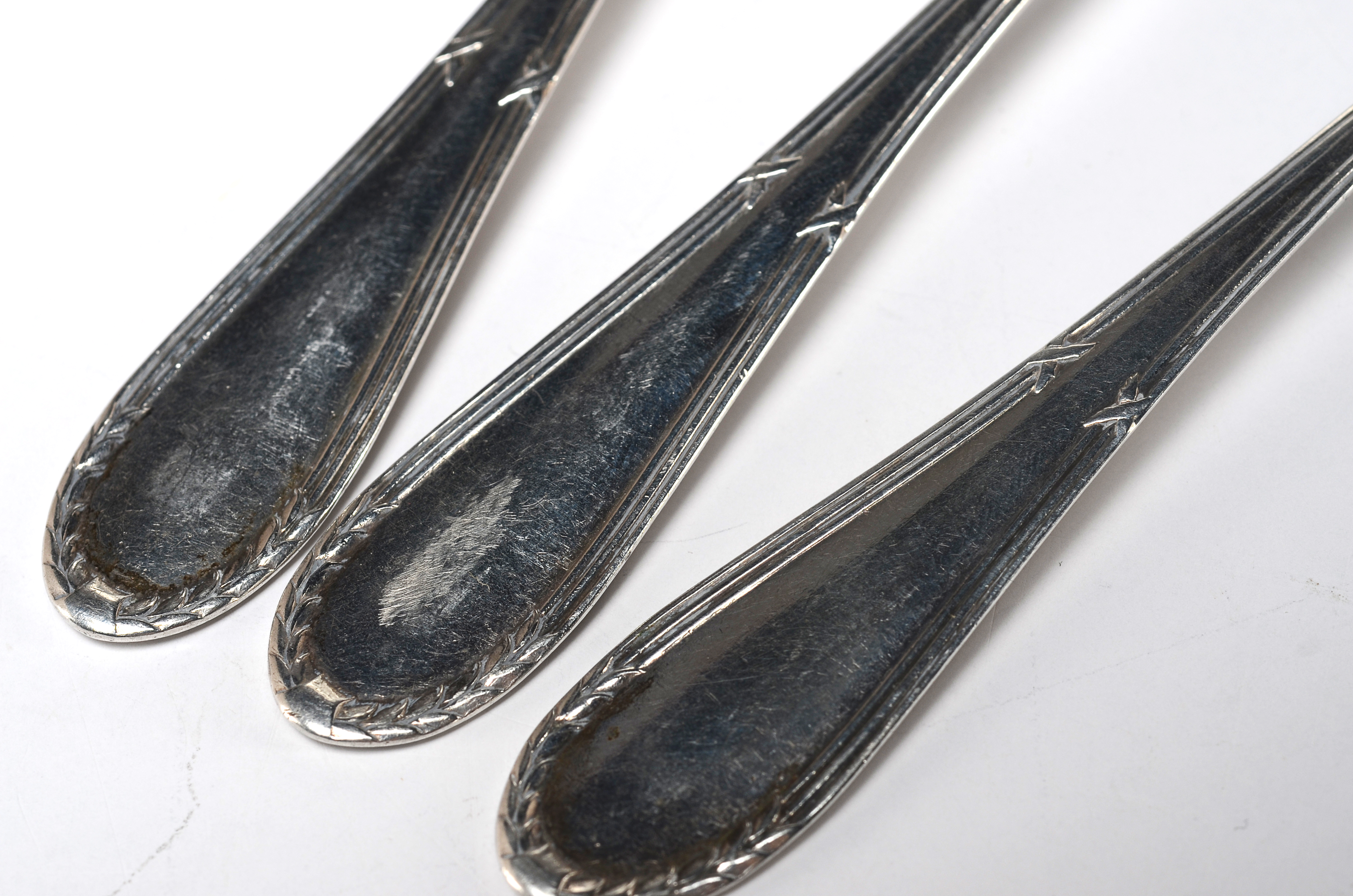 Three Early Twentieth Century Silver Plated Teaspoons and an aluminum Kromex serving plate.