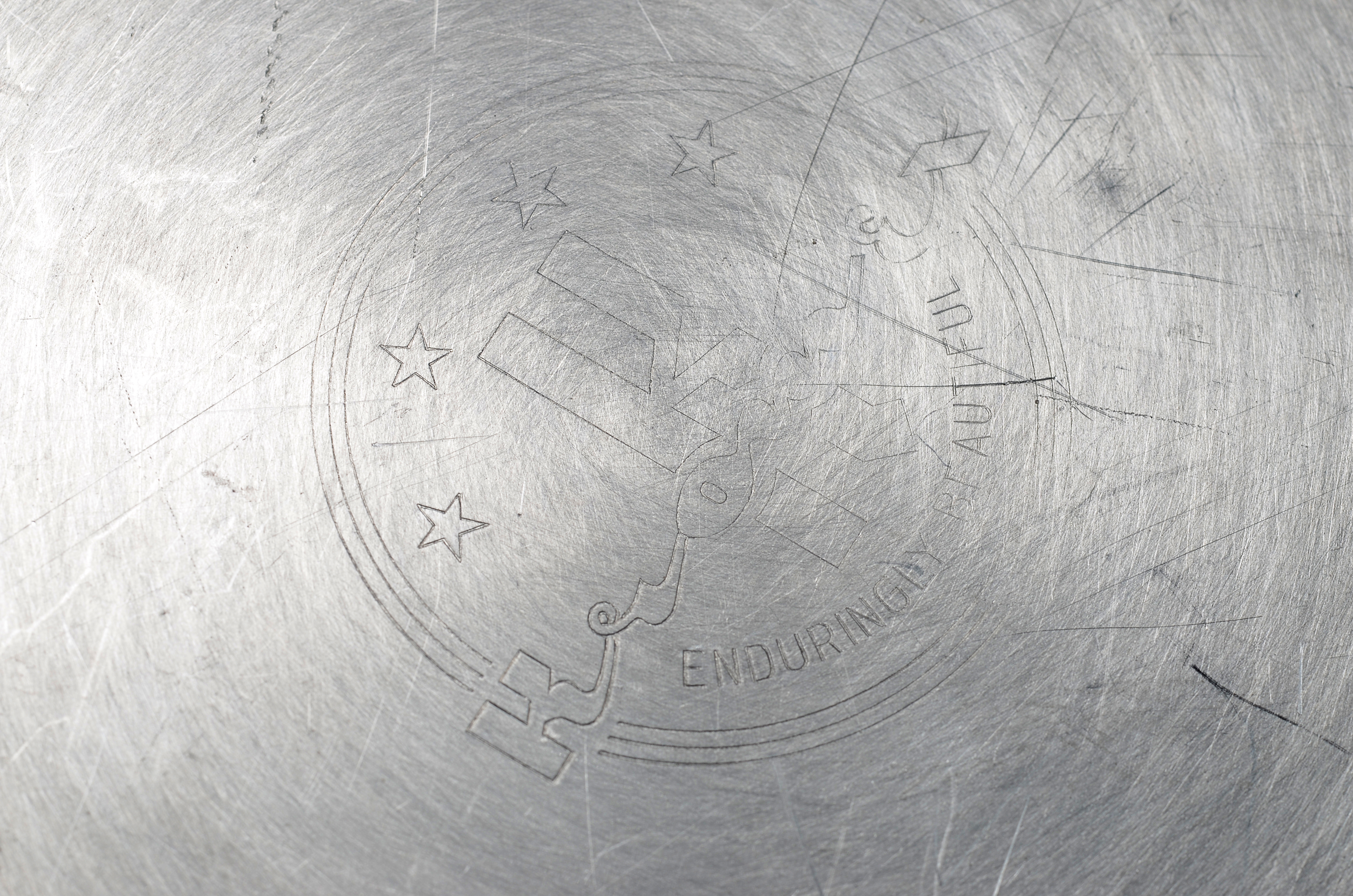 Three Early Twentieth Century Silver Plated Teaspoons and an aluminum Kromex serving plate.