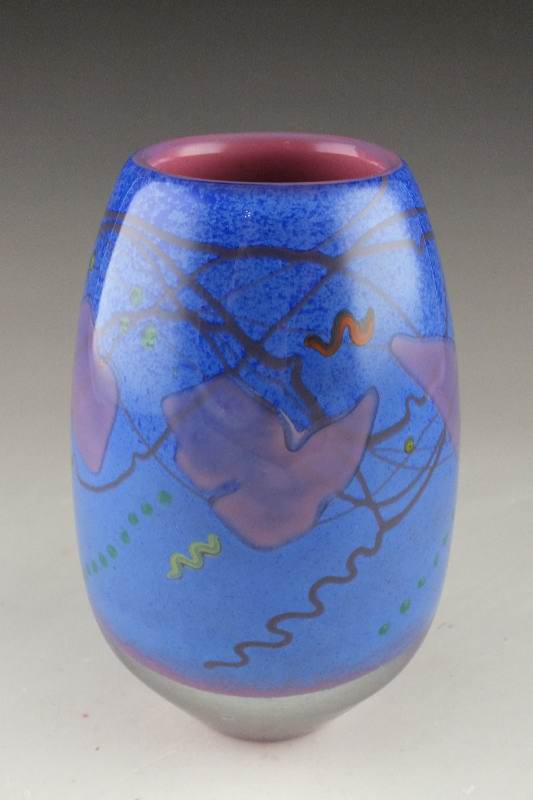 A hand blown colorful art glass vase signed by artist, D. Bacwell