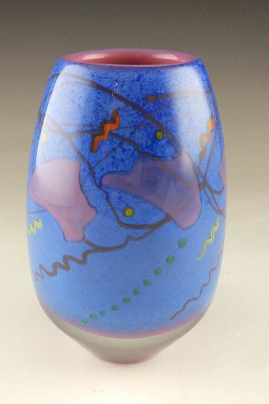 A hand blown colorful art glass vase signed by artist, D. Bacwell