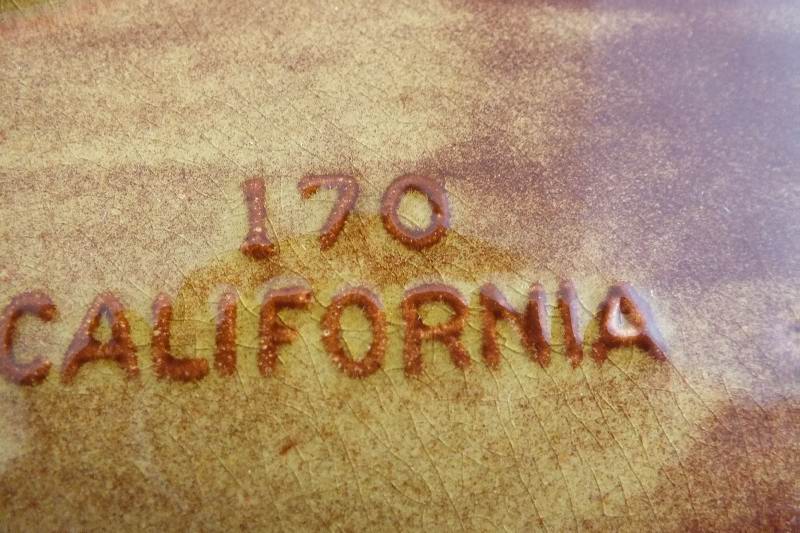 A set of five luncheon plates and 4 cups from California Pottery