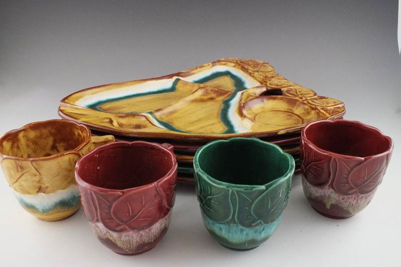 A set of five luncheon plates and 4 cups from California Pottery