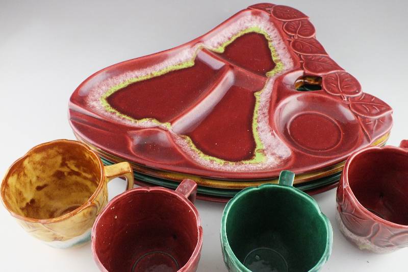 A set of five luncheon plates and 4 cups from California Pottery