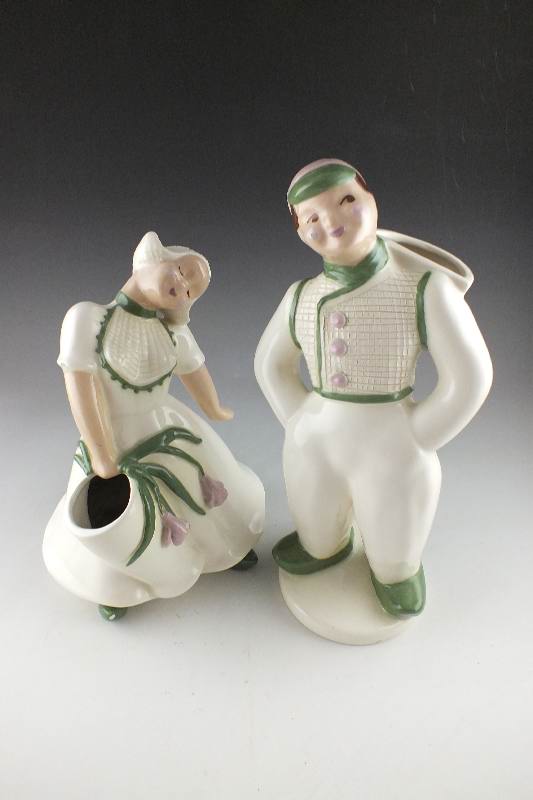 A pair of slip cast ceramic Dutch Boy and Girl planter figurines signed by California artist, Hedi Schoop circa  1950's