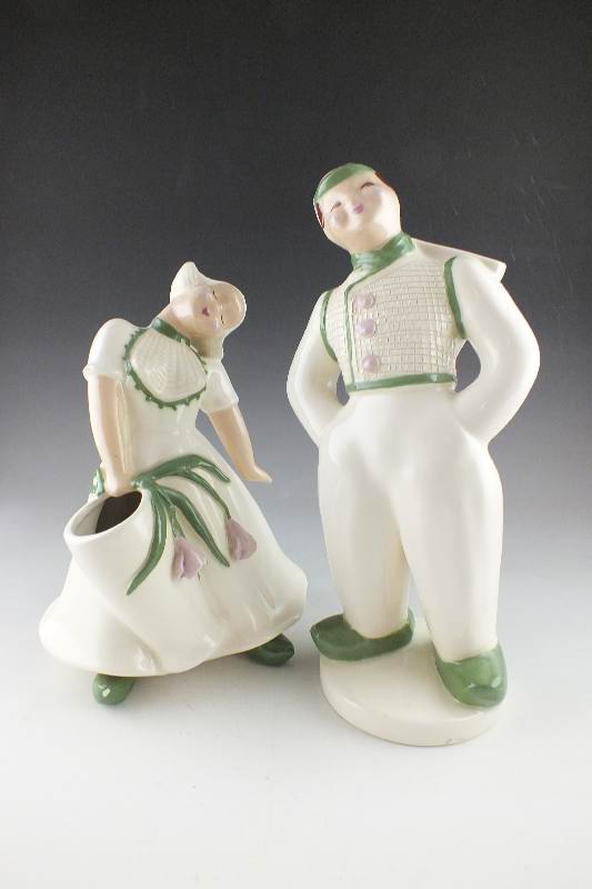 A pair of slip cast ceramic Dutch Boy and Girl planter figurines signed by California artist, Hedi Schoop circa  1950's