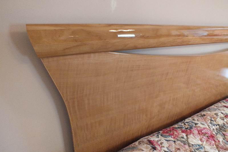 Contemporary style Queen size Qtr. Figured Anigre veneer and laminated woodgrain head board and foot board from USA Pilliod Furniture Inc., Division of Ladd Furniture