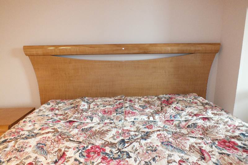 Contemporary style queen size Qtr. Figured Anigre veneer and laminated woodgrain head board and foot board from USA Pilliod Furniture Inc., Division of ladd Furniture