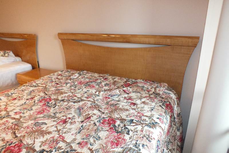 Contemporary style queen size Qtr. Figured Anigre veneer and laminated woodgrain head board and foot board from USA Pilliod Furniture Inc., Division of ladd Furniture