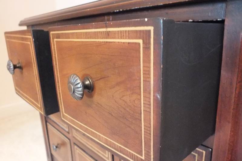A cute English style chest created from wood veneer accented with a contrasting painted inlay design