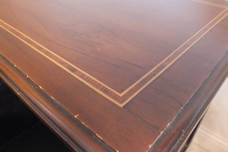 A cute English style chest created from wood veneer accented with a contrasting painted inlay design