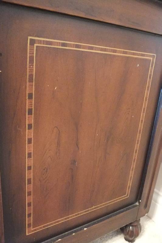 A cute English style chest created from wood veneer accented with a contrasting painted inlay design