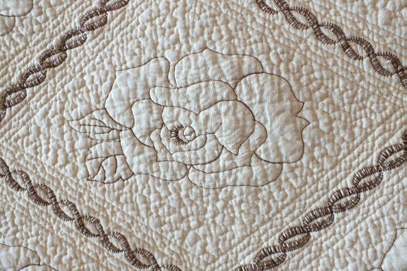 A pair of cotten quilted coverlets