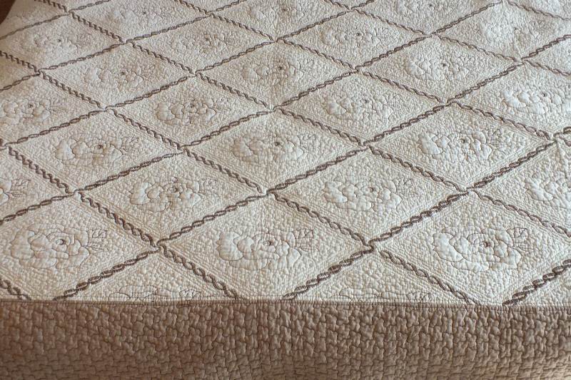 A pair of cotten quilted coverlets
