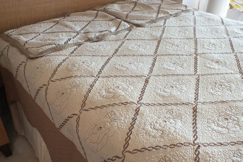 A pair of cotten quilted coverlets