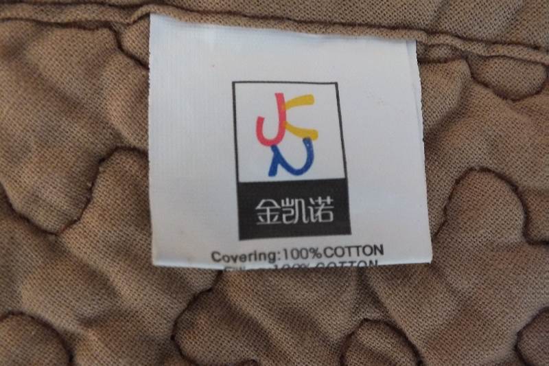 A pair of cotten quilted coverlets