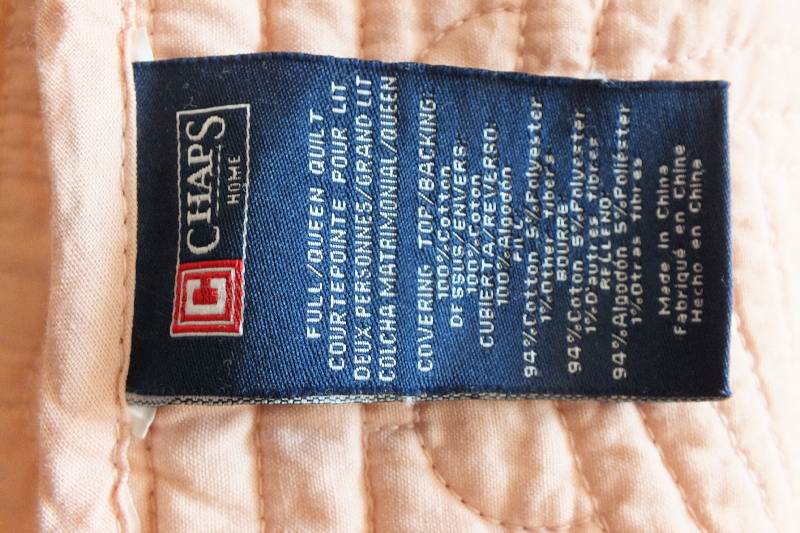 A pair of quilted dusty rose coverlets