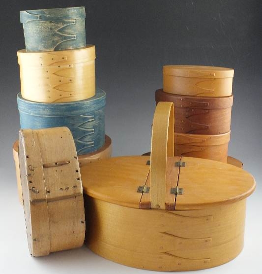 A collection of ten Shaker wooden boxes in assorted sizes and shapes and one Shaker basket