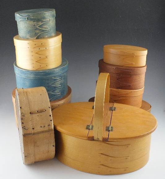 A collection of ten Shaker wooden boxes in assorted sizes and shapes and one Shaker basket