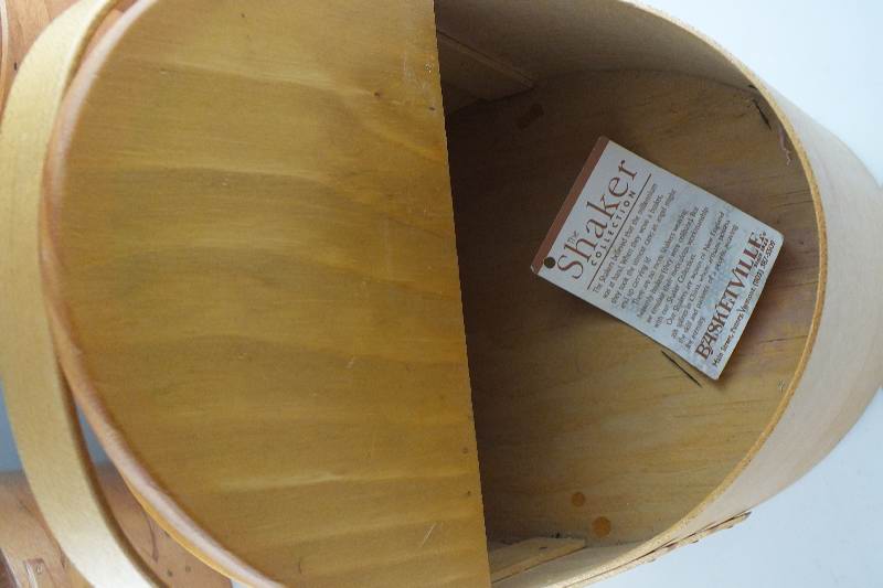 A collection of ten Shaker wooden boxes in assorted sizes and shapes and one Shaker basket