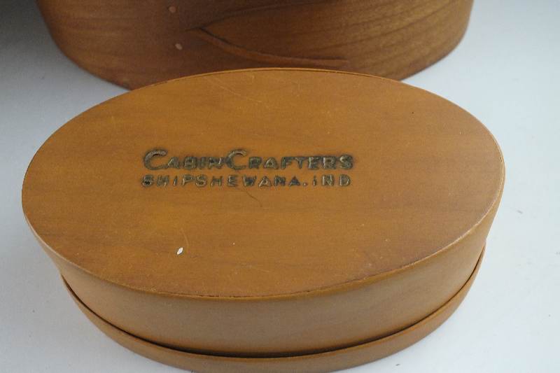 A collection of ten Shaker wooden boxes in assorted sizes and shapes and one Shaker basket