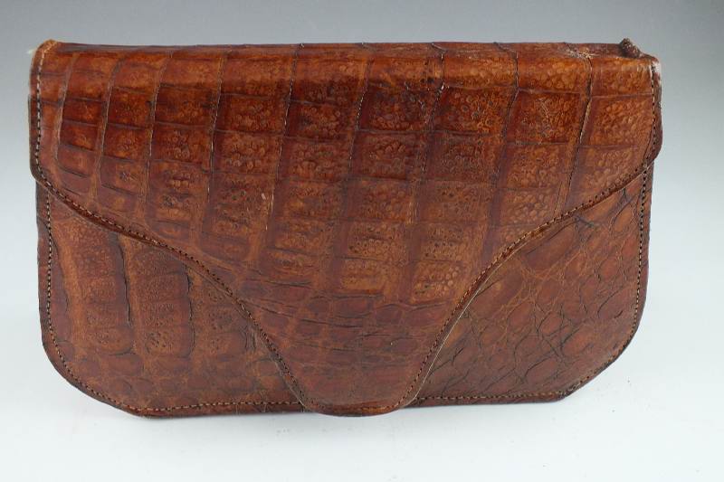 A vintage "Genuine Alligator" purse with snap enclosure and shoulder strap