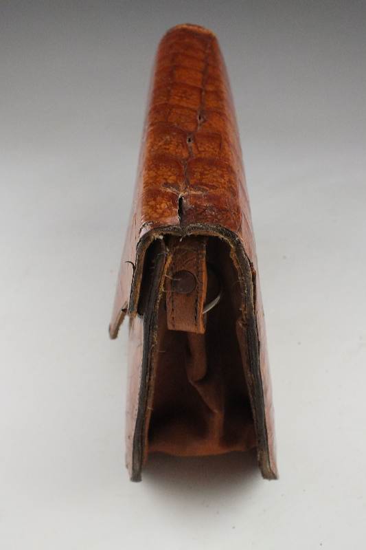 A vintage "Genuine Alligator" purse with snap enclosure and shoulder strap