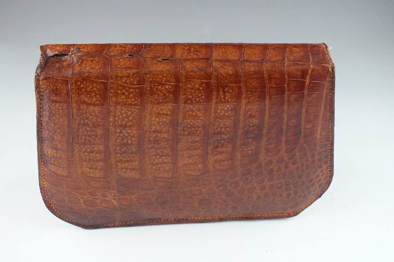 A vintage "Genuine Alligator" purse with snap enclosure and shoulder strap