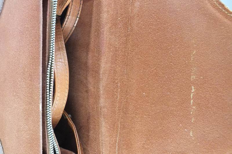 A vintage "Genuine Alligator" purse with snap enclosure and shoulder strap