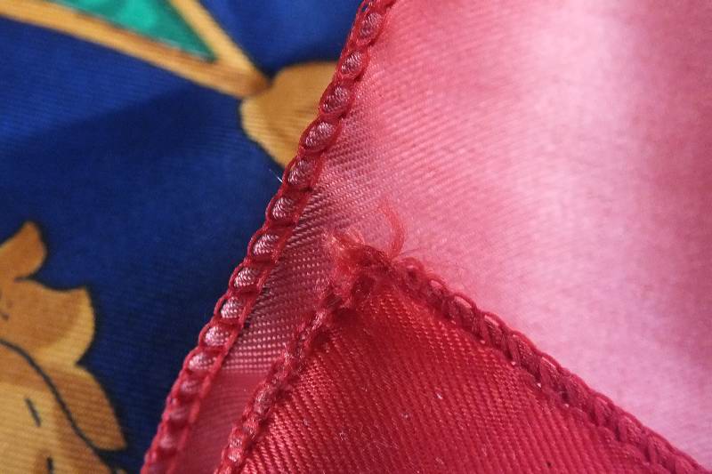 A lovely colorful silk scarf marked Hermes Paris