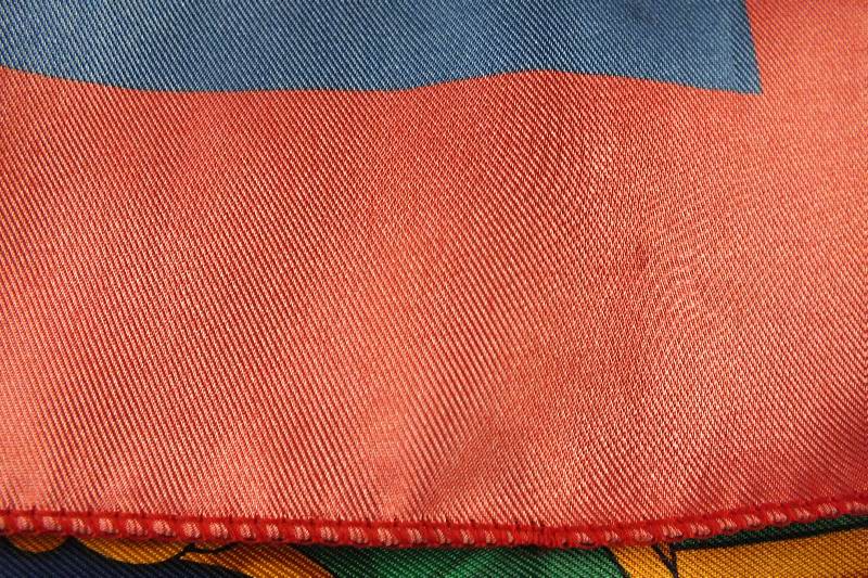 A lovely colorful silk scarf marked Hermes Paris