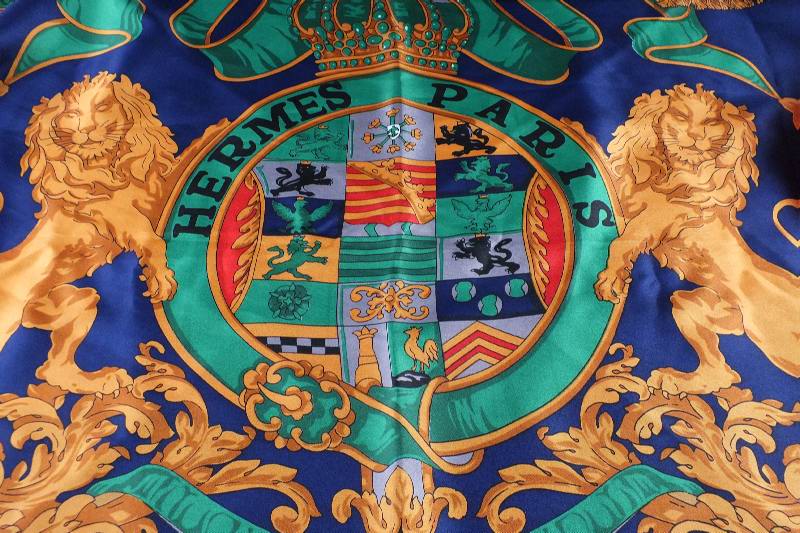 A lovely colorful silk scarf marked Hermes Paris