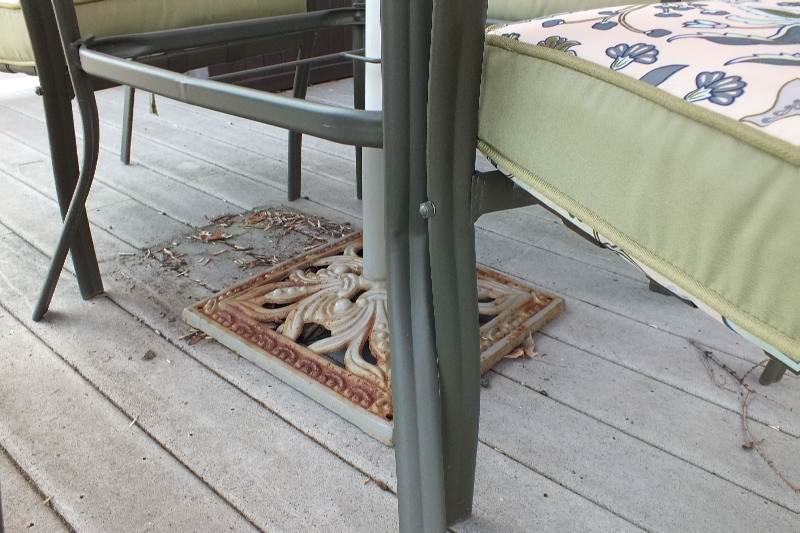 Outdoor dining table with large umbrella and chairs