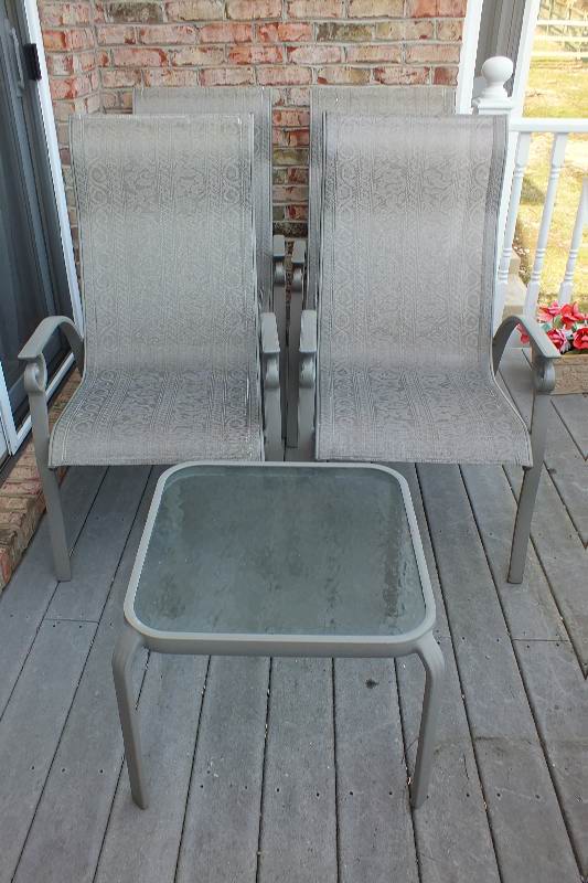 Four painted aluminum outdoor chairs