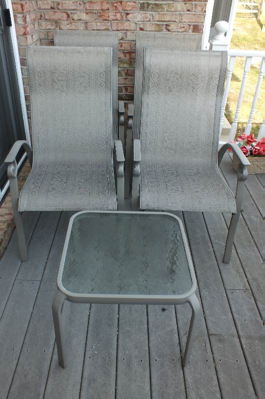 Four painted aluminum outdoor chairs