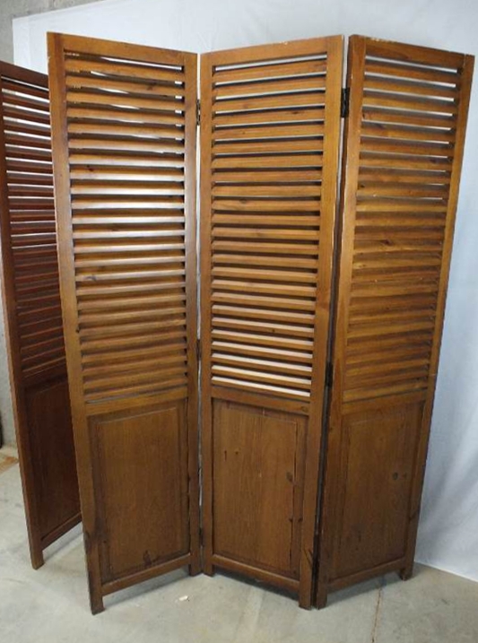 A pair of  louvered wood screens