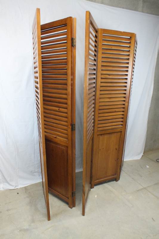 A pair of  louvered wood screens