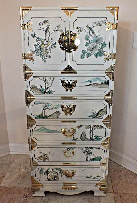 A tall Asian chest of drawers