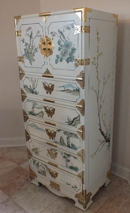 A tall Asian chest of drawers