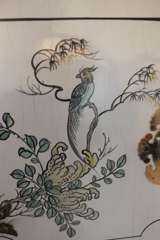 A tall Asian chest of drawers