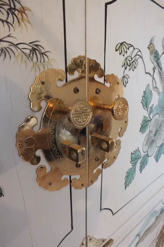 A tall Asian chest of drawers