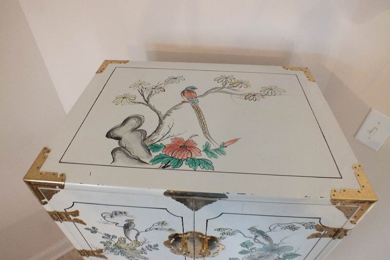 A tall Asian chest of drawers