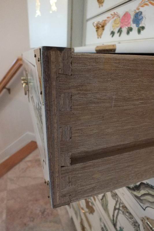 A tall Asian chest of drawers