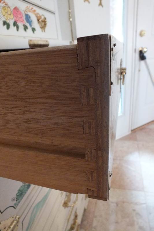 A tall Asian chest of drawers