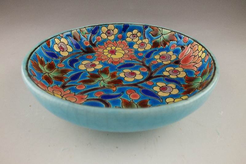 A lovely and colorful small ceramic dish marked "Longwy France, Decore a la Main, Made in France"